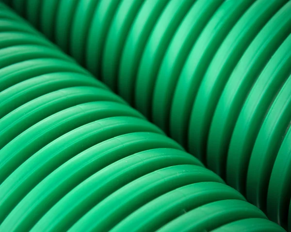Green plastic pipes — Stock Photo, Image