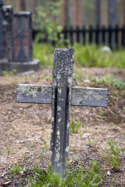 Wooden cross on old grave yard