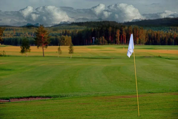 Golf vlajka při západu slunce — Stock fotografie