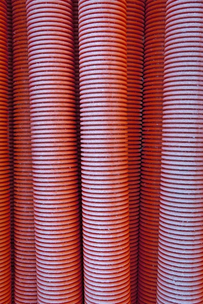 Red plastic pipes Stock Image