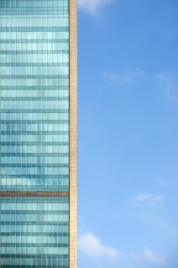 Office building on blue sky clipart