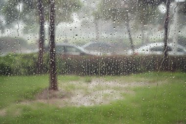 Glass window in rain storm clipart