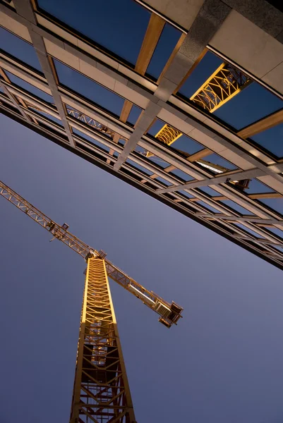 Reflection of a crane in an office building — Stock Photo, Image