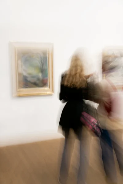 Two at arts exhibition — Stock Photo, Image