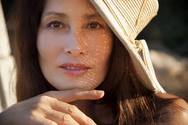 stock image Mature woman in a hat, on the nature