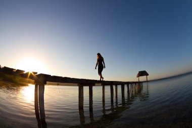 White dress against a beautiful sunrise clipart