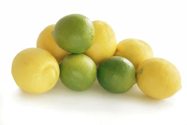 Green and yellow citrus fruits — Stock Photo, Image