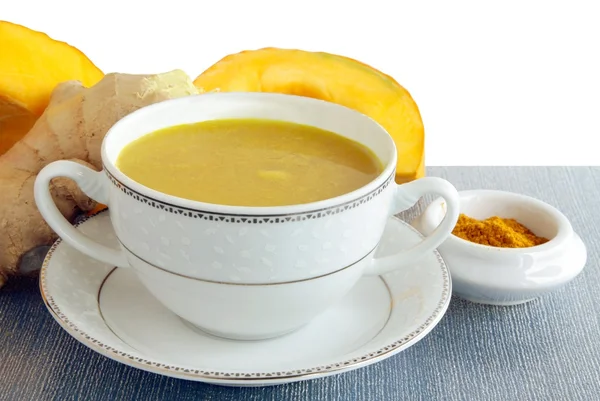 Pumpkin soup with curry spice and imbir root as condiments — Stock Photo, Image
