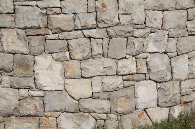 Limestone wall built without any mortar clipart