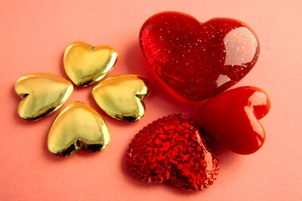 Red and gold hearts as symbols of love and kindness — Stock Photo, Image