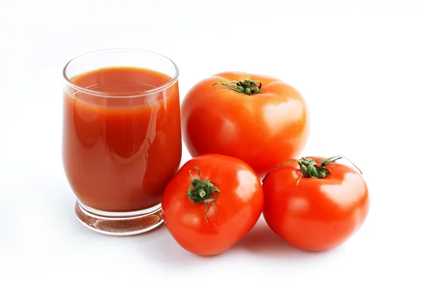 Tomates vermelhos e suco — Fotografia de Stock