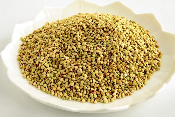 Raw buckwheat seeds as groats — Stock Photo, Image