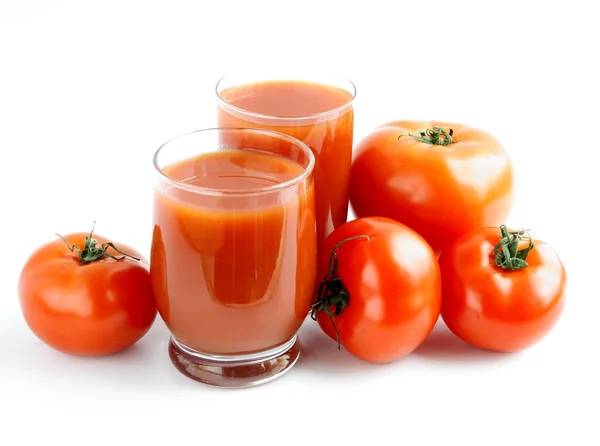 Tomatoes and juice — Stock Photo, Image