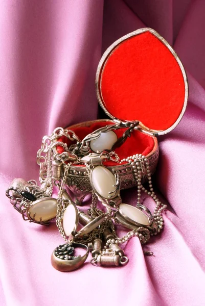 Silver jewerly in ornamental metallis box — Stock Photo, Image
