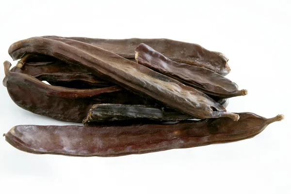 Cáscaras de algarroba marrón — Foto de Stock