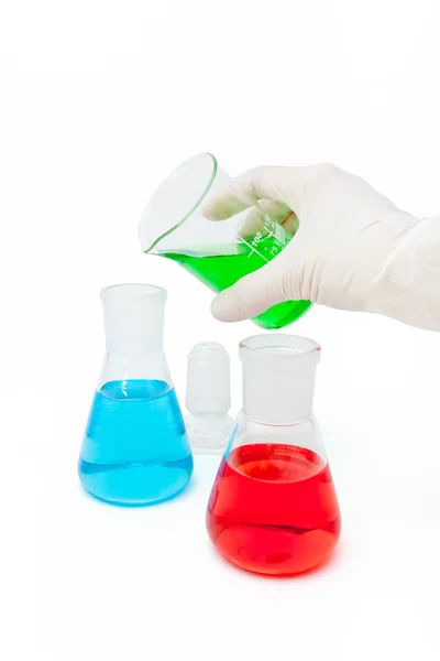 Colored solution in laboratory flasks — Stock Photo, Image