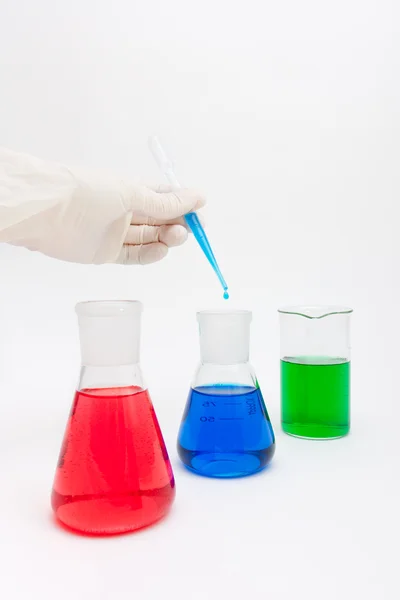 Colored solution in laboratory flasks — Stock Photo, Image