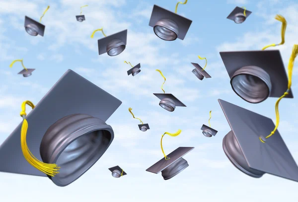 stock image Graduation caps thrown in the air