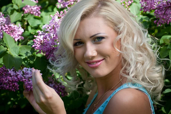 stock image Young blonde woman in the park