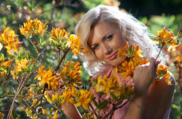 stock image Young blonde woman in the park