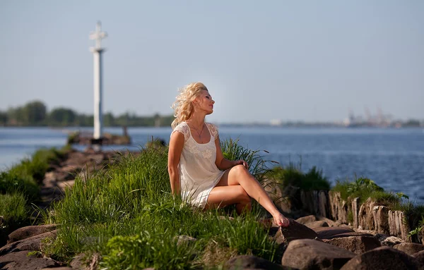 stock image Young blonde woman in the park