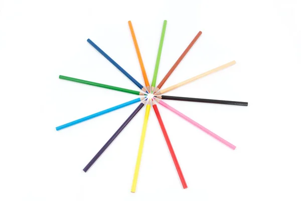 Set of colored pencils in the shape of a star. On a white backgr — Stock Photo, Image