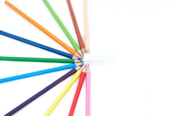 Um conjunto de lápis de cor em forma de meia estrela e de borracha. — Fotografia de Stock