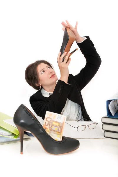Beautiful business woman looking at her shoe. — Stock Photo, Image