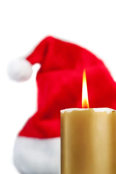 Christmas candle on the background of trees. — Stock Photo, Image