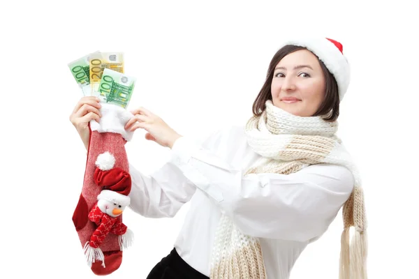 Noel Baba şapkalı kız çorap parayla holding. — Stok fotoğraf