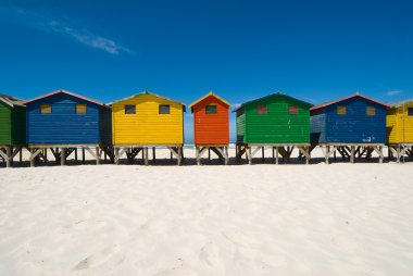 Multi colored beach huts clipart