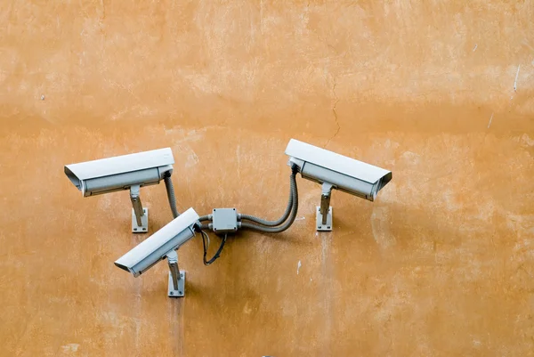 stock image Surveillance cameras on old wall