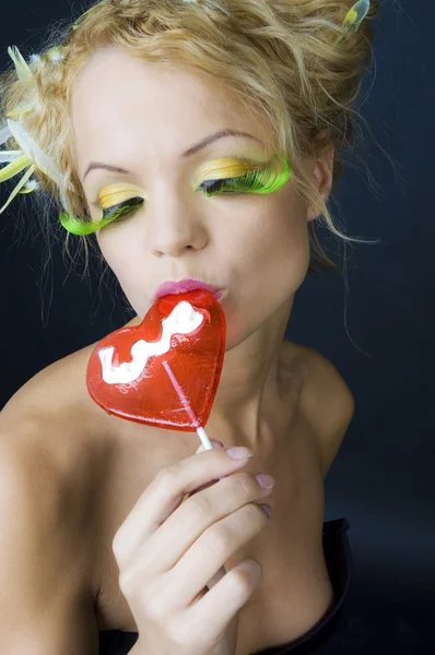 Fashion beauty girl with lollipop — Stock Photo, Image