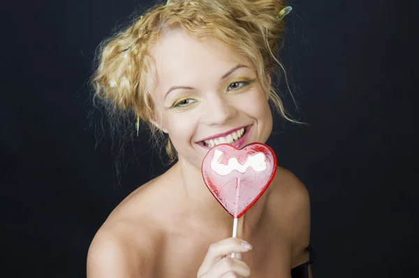 Portrait of a funny girl with candy — Stock Photo, Image