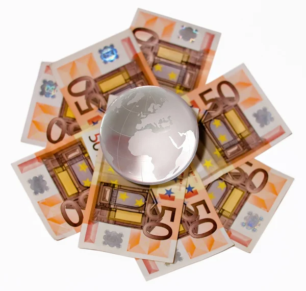 Glass globe with a focus on Europe and Africa on a Euro bills on — Stock Photo, Image
