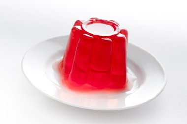 Strawberry gelatin on a dish clipart