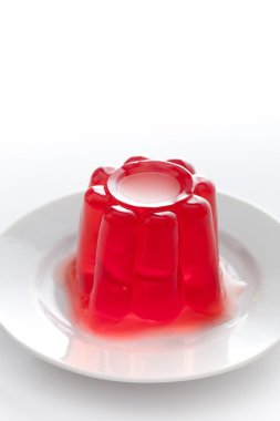 Strawberry gelatin on a dish clipart