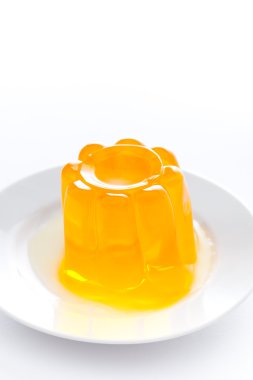 Orange gelatin on a dish clipart