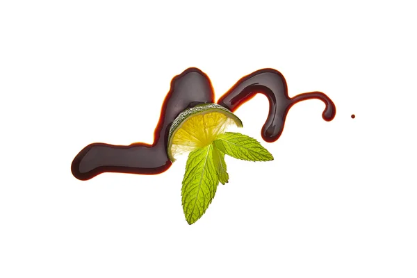 Schokolade flüssig sirup kunst obst limette frucht — Stockfoto