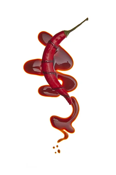 Schokolade flüssig sirup kunst scharf hot chilischote — Stock Photo, Image