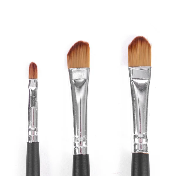 Pinsel puder palet kosmetikerin make-up schminken — Stockfoto