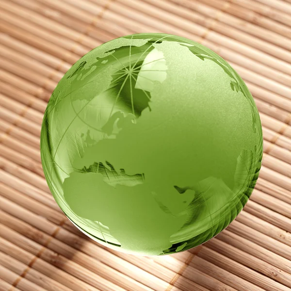 Globus erdball geo karte glas kristal bienestar bambú — Foto de Stock