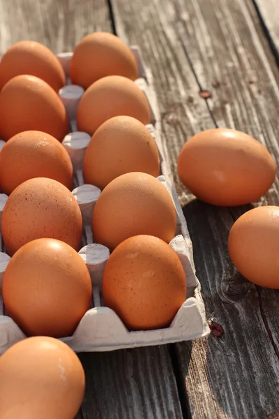 stock image Eggs on a wooden background