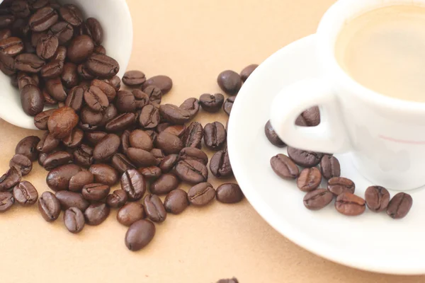 stock image Cup of coffee on a beige background