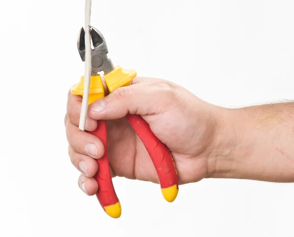 Hand met snijden tangen — Stockfoto