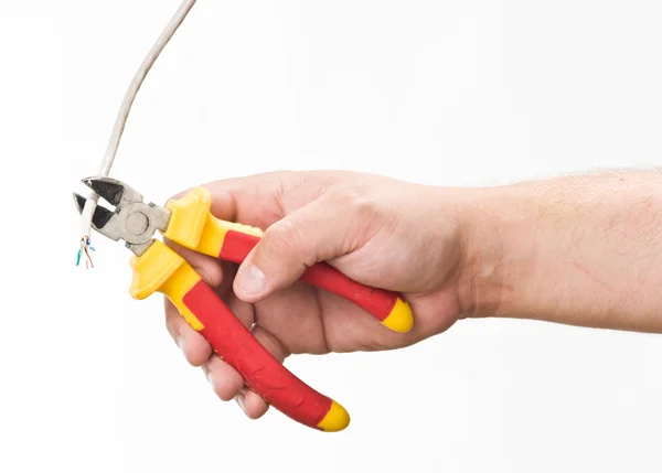 Hand with cutting pliers — Zdjęcie stockowe
