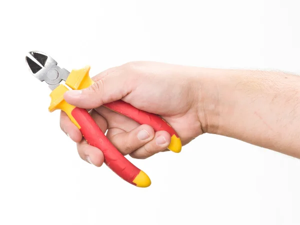 Hand with cutting pliers — Zdjęcie stockowe