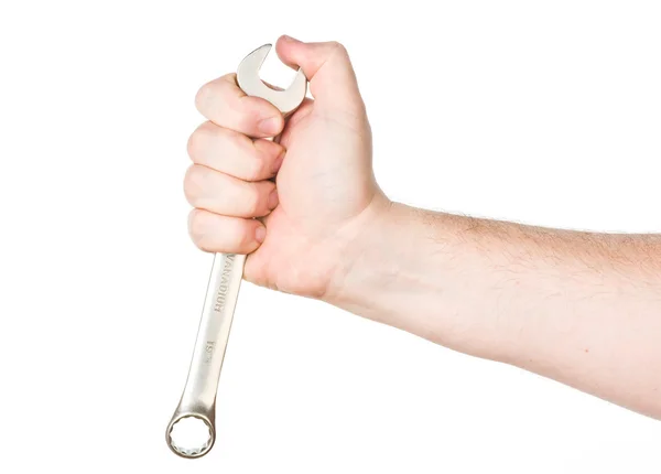 Hand met moersleutel — Stockfoto
