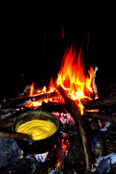 stock image Hominy - traditional food at camp fire