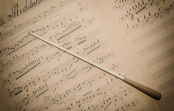 Musicale spartito con bacchetta — Φωτογραφία Αρχείου